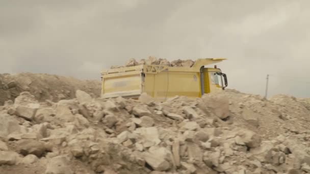 Truck on a road in quarry carring stones — Stock Video