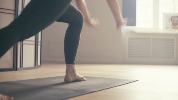 A young woman performing yoga-asanas — Stock Video