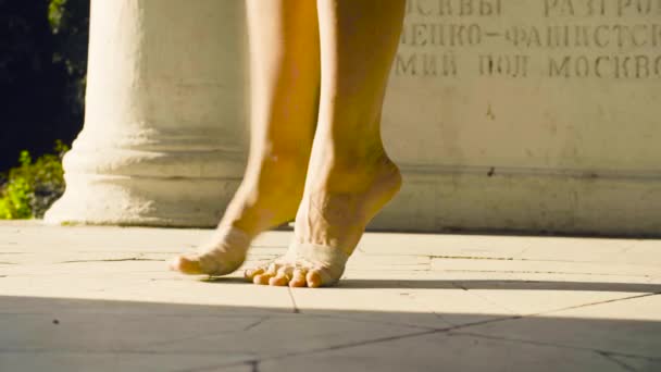 Bare feet of a woman dancing on a stone floor — Stock Video