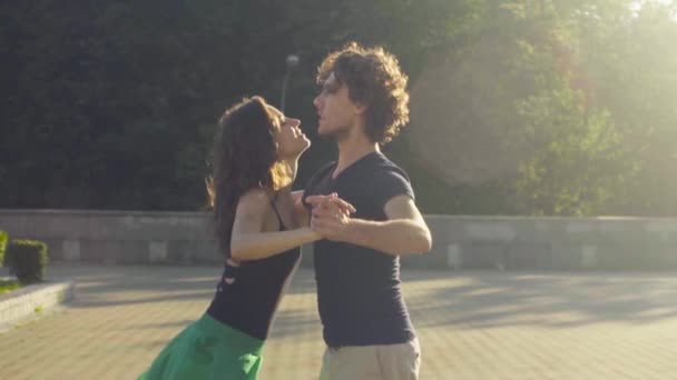 Young couple dancing on the square — Stock Video