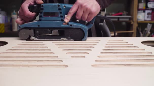 Grinding a furniture part with a handheld machine — Stock Video