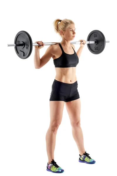 Fitness girl doing barbell squats — Stock Photo, Image