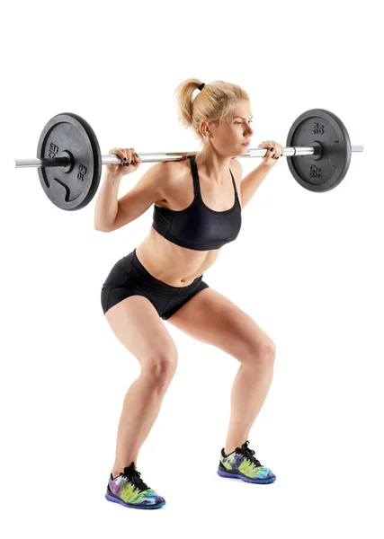 Fitness dívka dělá squaty barbell — Stock fotografie