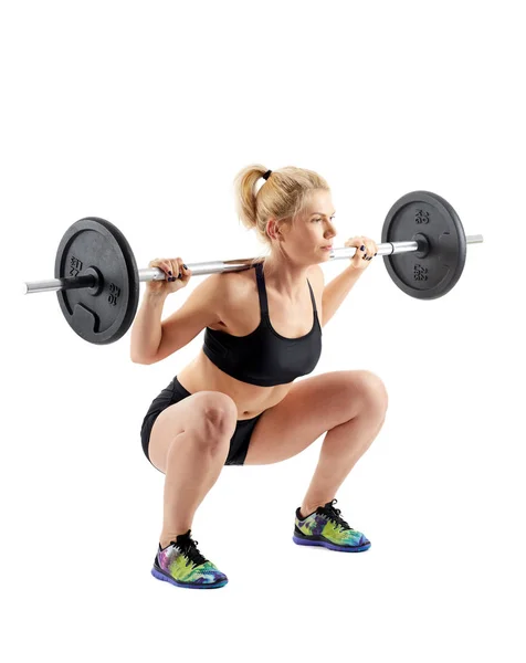 Fitness girl doing barbell squats — Stock Photo, Image