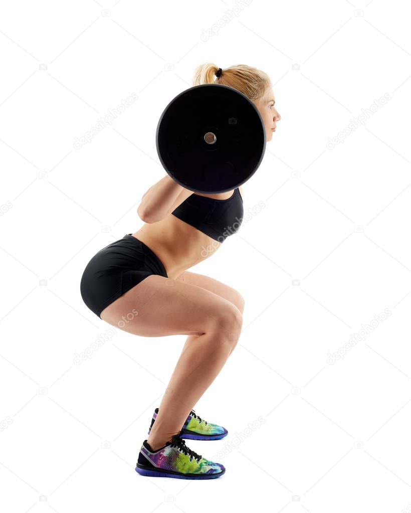 Fitness girl doing barbell squats