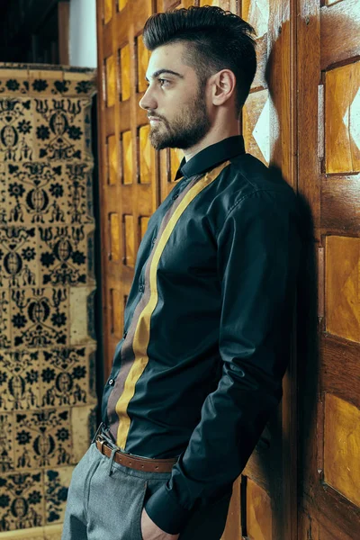 Young man in vintage interior — Stock Photo, Image