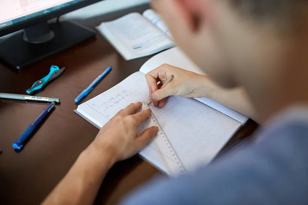 Teenage student doing homework — Stock Photo, Image