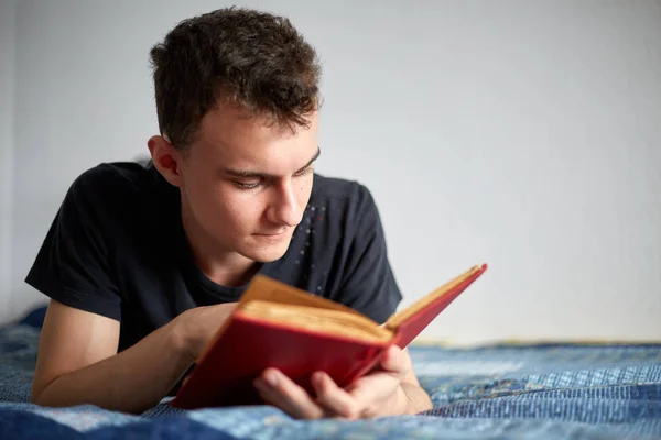 Teenager reading book — Stock Photo, Image