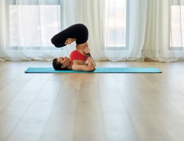Yoga trainer in asana