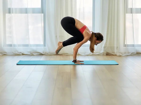 Yoga trainer in asana — 스톡 사진