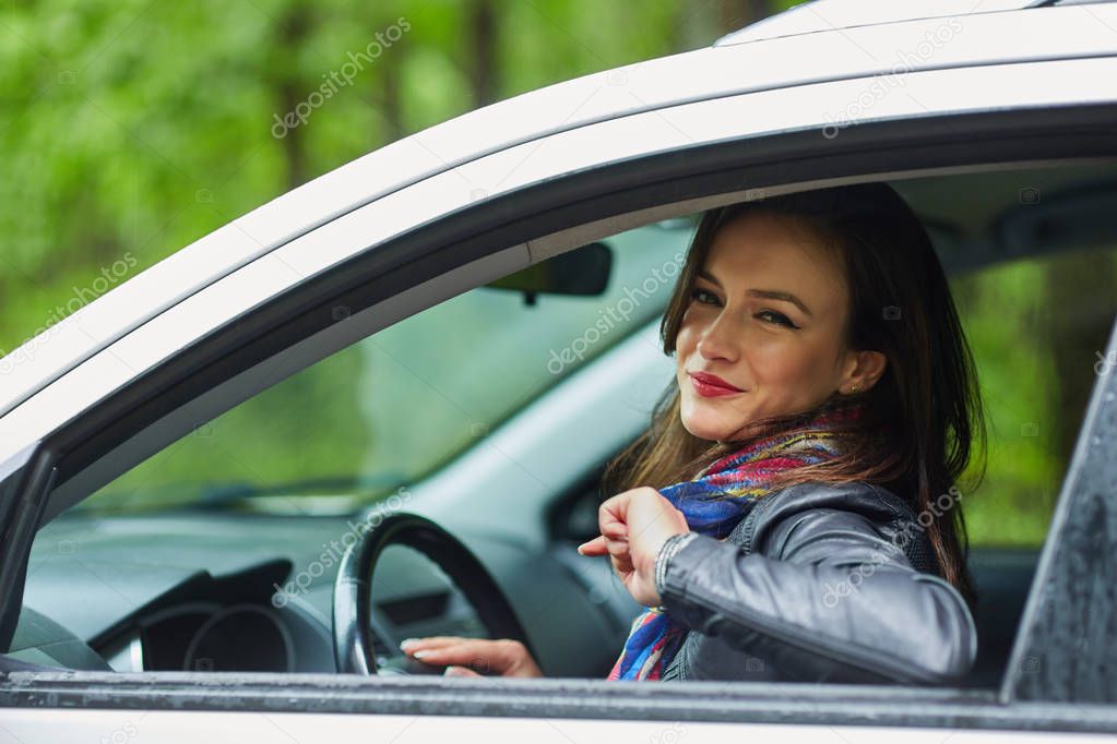 Cheerful woman in new car