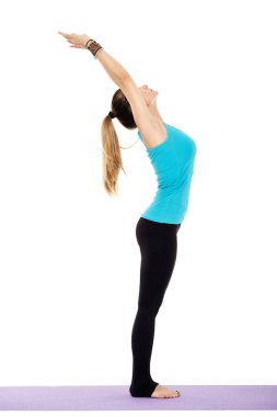 Woman stretching on yoga mat clipart