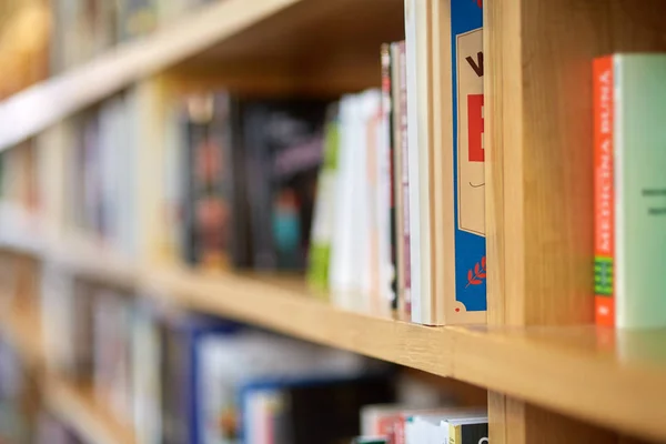 Books on shelves in a public library — Stock Photo, Image