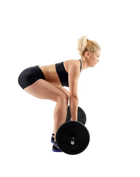 Donna che fa deadlift con bilanciere — Foto Stock