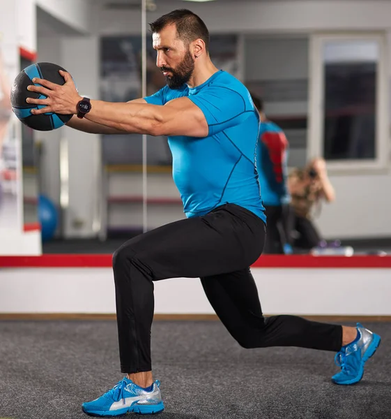 Fitness trainer with medicine ball — Stock Photo, Image