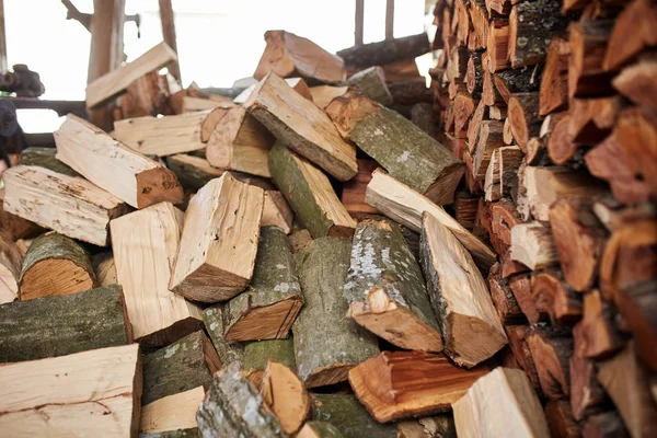 Stacked splitted beech logs — Stock Photo, Image