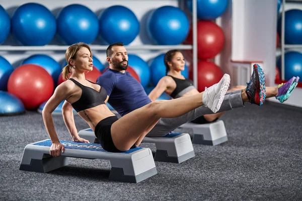 Fitness Team Doing Abs Crunches Steppers Gym — Stock Photo, Image