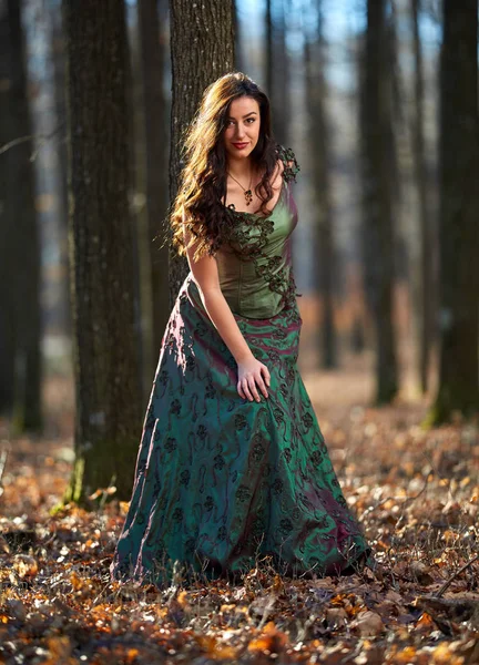 Portrait of a woman in green dress outdoor — Stock Photo, Image