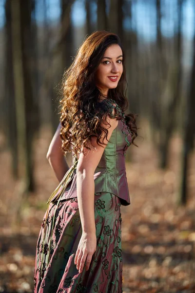 Portrait of a woman in green dress outdoor — Stock Photo, Image