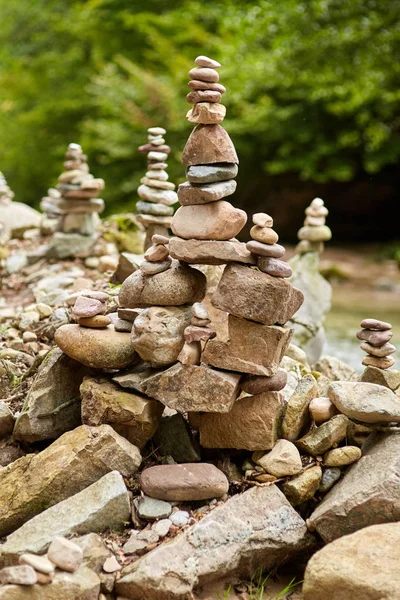 River pebbles arranged in artistic zen-like stacks