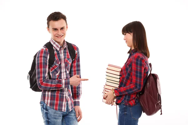 Unhappy Teenager Holding Books While Being Made Fun Stock Photo