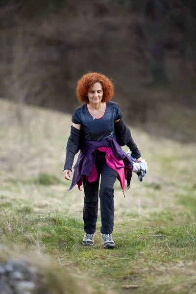 Woman hiking on a trail