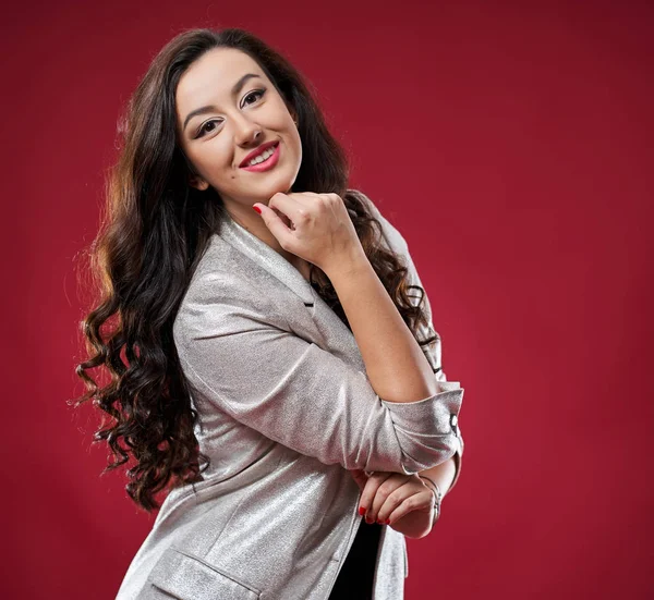 Young businesswoman on red background — Stock Photo, Image