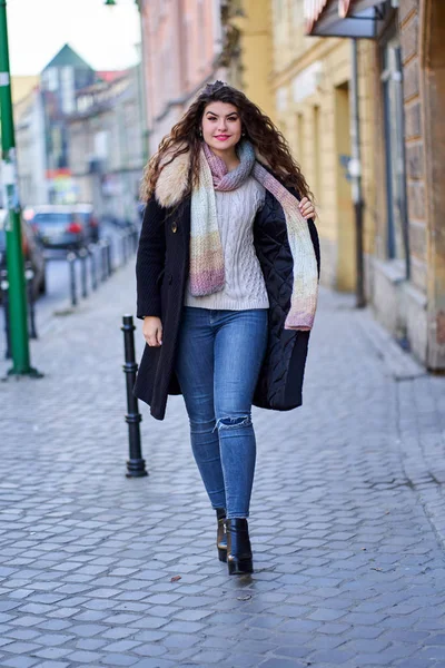 A young woman in an urban environment, old town