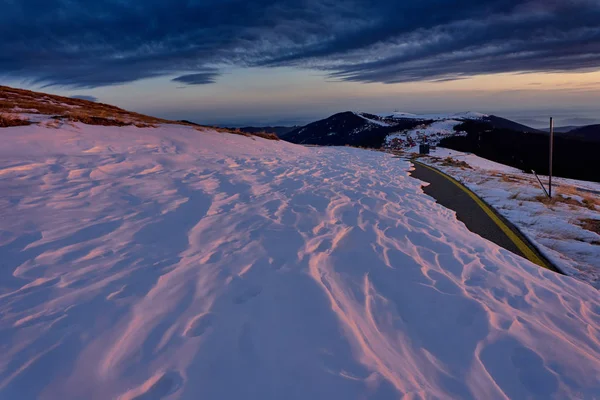 Road Covered Snow Mountains 스톡 사진