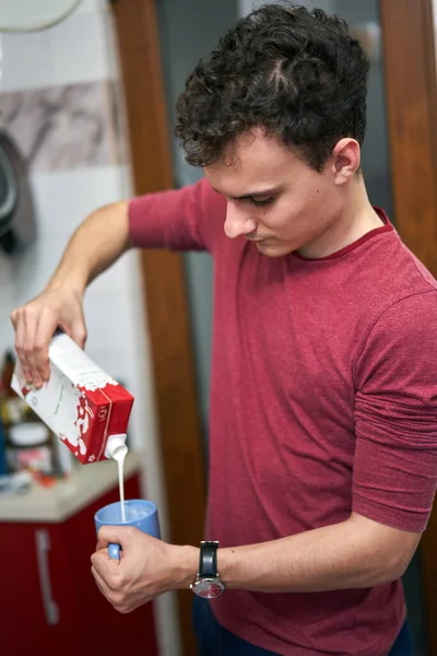 Young Man Pouring Mllk Cream Cup Recipe — Stock Photo, Image