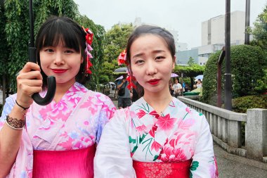 Modern japanese girls in traditional kimono  clipart