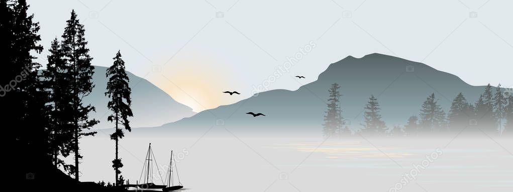 Mountain view with flying birds during sunrise