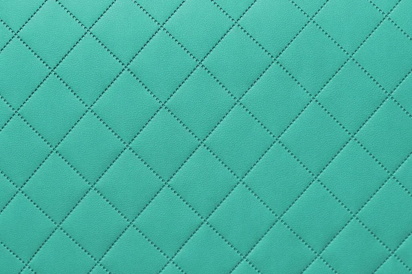 Detalhe de couro costurado turquesa, estofos de couro ônix padrão de fundo — Fotografia de Stock