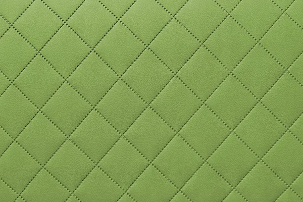 Detalle de cuero cosido verde, patrón de fondo de tapicería de cuero verde — Foto de Stock
