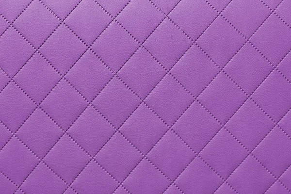 detail of purple sewn leather, pink leather upholstery background pattern