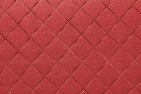 Detalj av röda sydda läder, grå läderklädsel bakgrundsmönster — Stockfoto