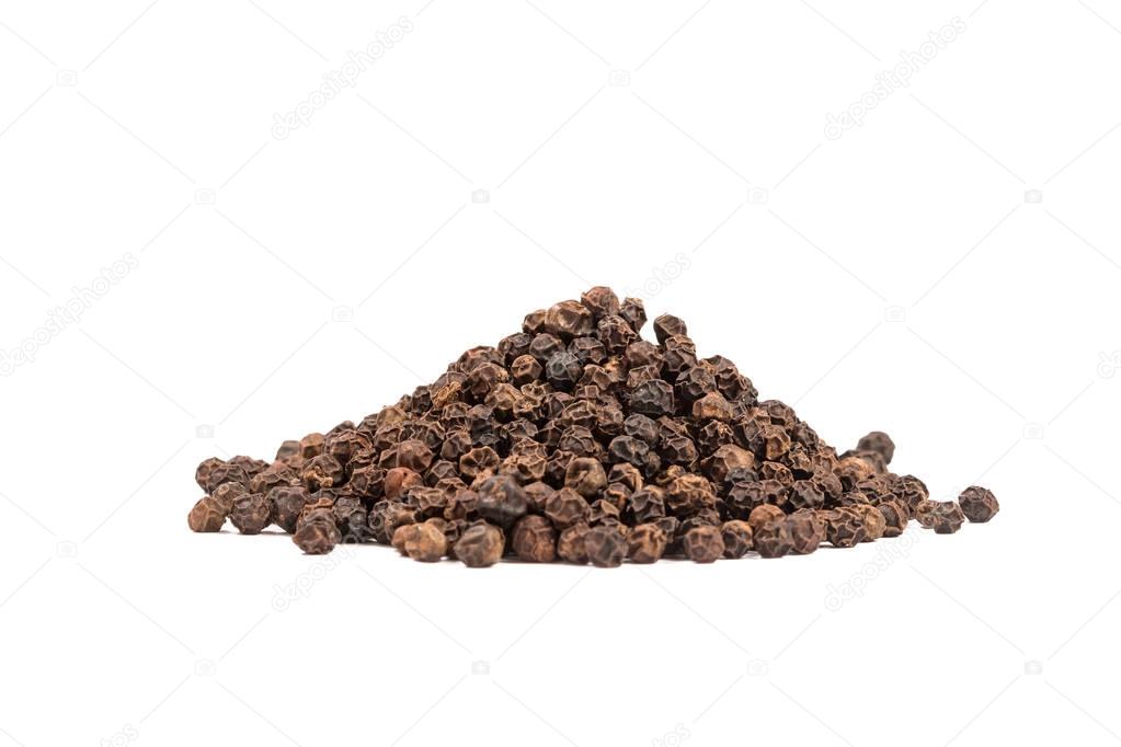 Pile of black whole pepper isolated on white background