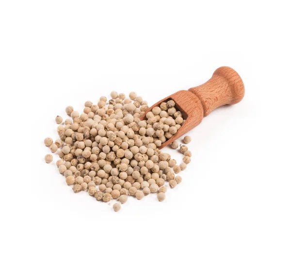 Wooden shovel with white pepper scattered from it — Stock Photo, Image