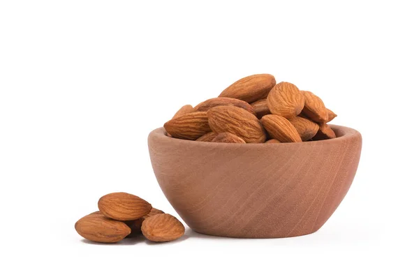 Bio organic almonds in wooden bowl isolated on white background. — Stock Photo, Image