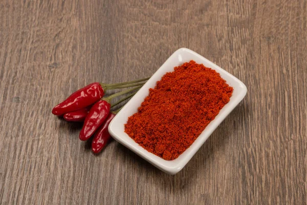 Red chili pepper with chili powder — Stock Photo, Image