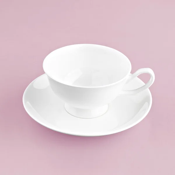 Tasse blanche sur fond rose — Photo