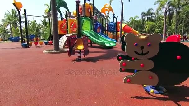 Walk to the playground in public park at sunny day. — Stock Video