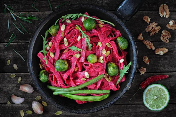 Tagliatelle pasta with beet sauce — Stock Photo, Image