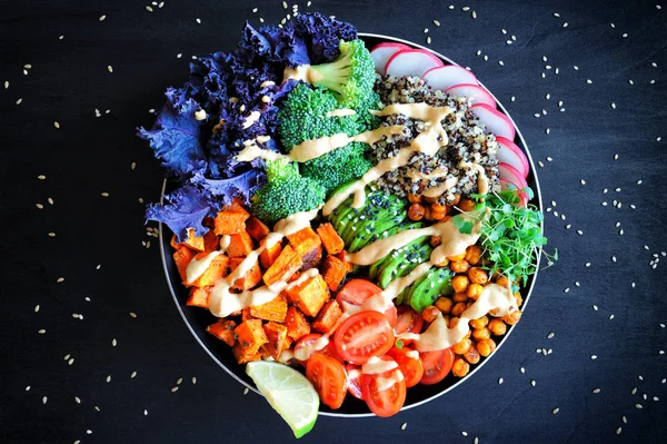 Vegan Buddha bowl with quinoa, baked sweet potato and red kale l Stock Image