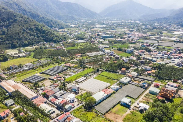 Aerial view of Puli town with buildings and farms — Stock Photo, Image