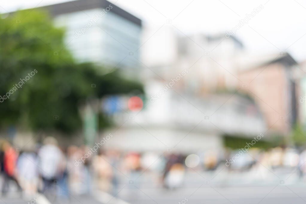 blurred city scenery with people walking