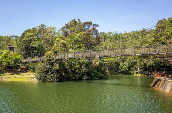 Pond with suspension bridge at Toushe Reservoi — Stock Photo, Image