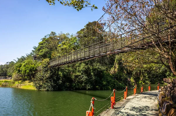 Pond with suspension bridge at Toushe Reservoi — Stock Photo, Image