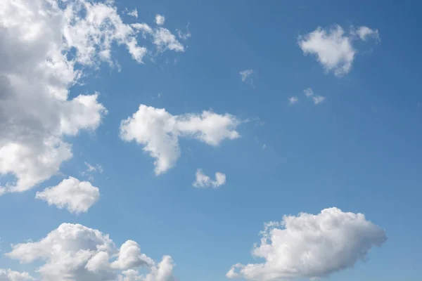 stock image white clouds over blue sky