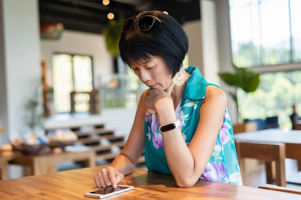 Woman using smartphone with smart watch — Stock Photo, Image